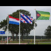 The flags of the Netherlands, Friesland province and the village of Donkerbroek.