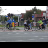 The bike heading to the right, with its typical Dutch passenger arrangement, has just come of the en...