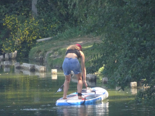 The Seine had lots of warnings telling people not to swim. Here, swimming is allowed and there are a...