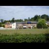 Buildings next to the football pitch in Bonnebosq. While I was sitting here having a rest, people ar...