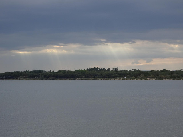 Sunlight coming through the clouds.