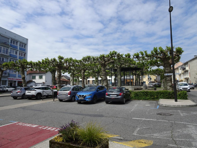 Near the bandstand, there is a stone bearing the name "SQUARE Pierre BLEULER", with "...