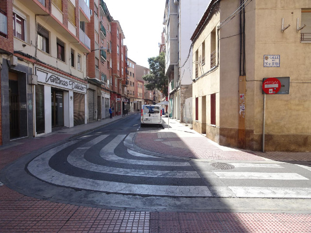 The zebra crossing goes round a corner.