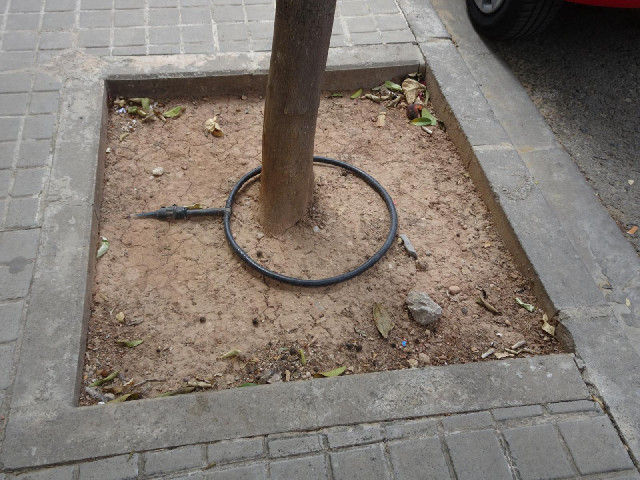 I'm now near to today's last target. The street where I've parked has these hoses embedded in the gr...