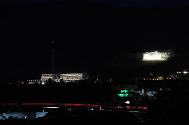 That sign looks huge. It's further away than the big building.