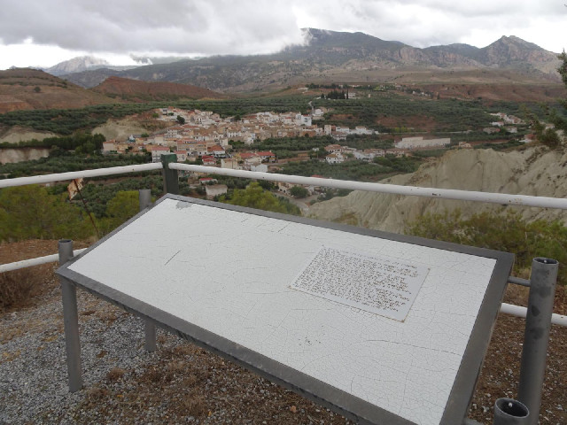 Whatever writing was painted on that information board has long since faded away, leaving just the B...