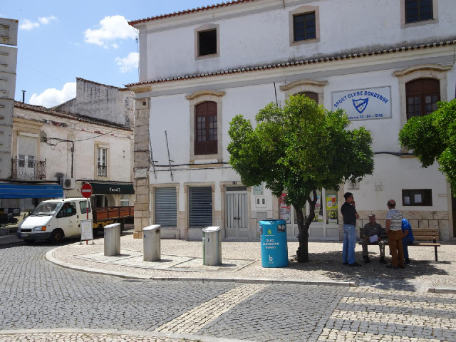 The recycling bins here include the blue one for oil.