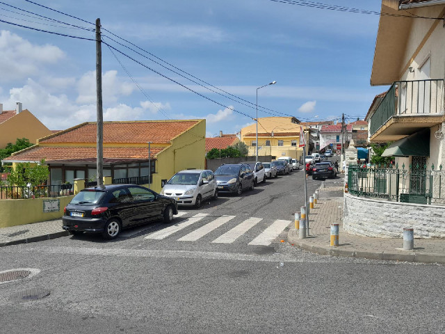 There is quite a lively bar on the right, with people milling around on the pavement, so I won't be ...