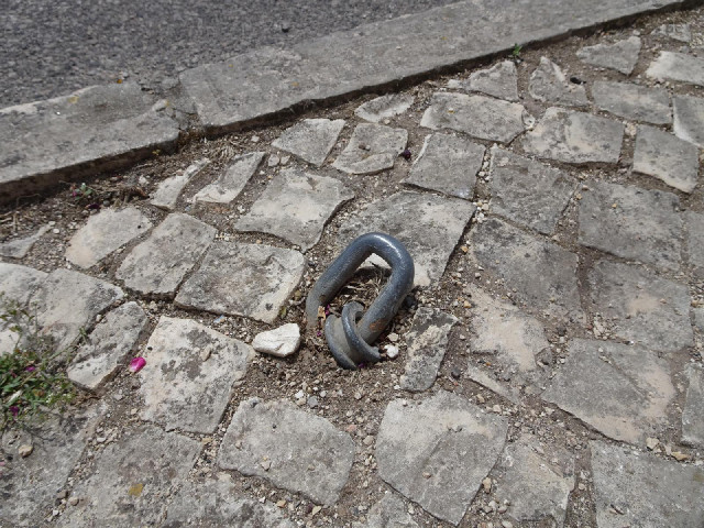 What's that for? Perhaps a guy wire for a pole which no longer exists.