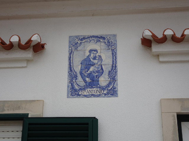 A lot of the houses that I've seen today have had depictions of St. Anthony. Most of them use a pict...
