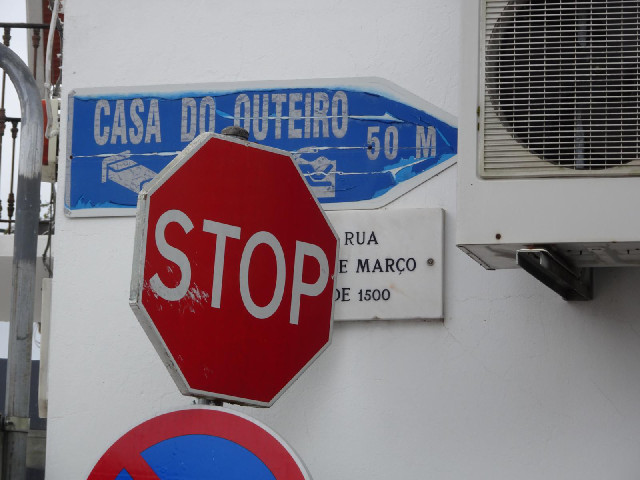 The sign at the bottom of the road has better paintwork but it's obstructed.