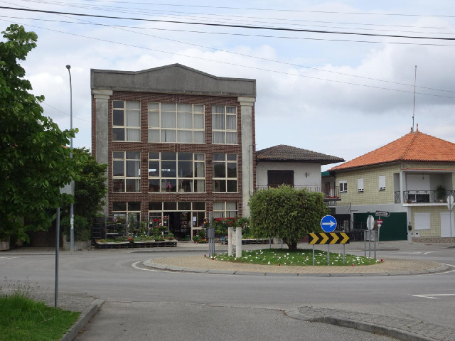 The building in the background is a shop selling plants.