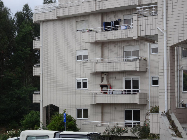 One of the balconies has an oven whose chimney has somehow been connected into the building's main c...