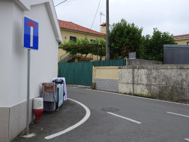 To take the picture of that sign I had to stand next to somebody's washing.