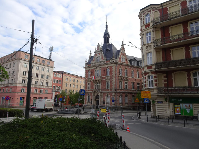 Ratajskiego Square. 23rd February Street is the road on the right of the gothic building.