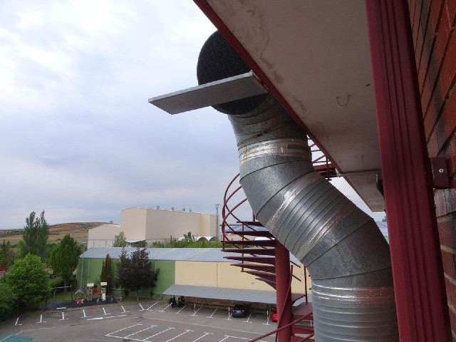 For some reason, the exhaust flue from the kitchen vents onto that metal shelf.