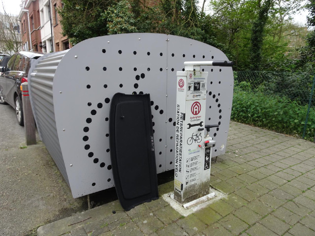 It looks like some kind of bike repair station but I don't know how it works.