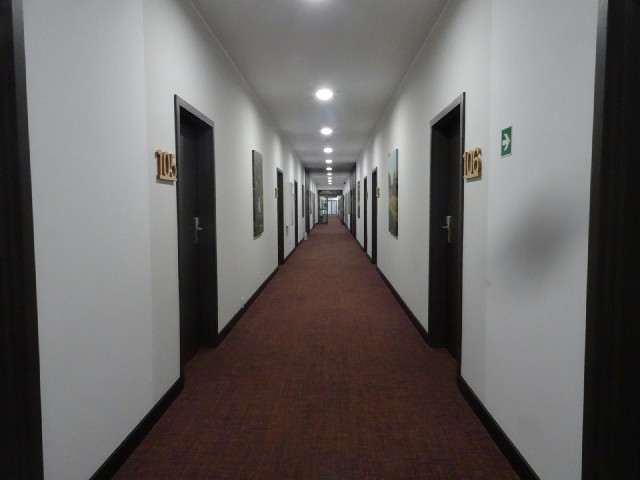 The corridor is unusually wide. The motion-sensing lights have a very short timer. The first time I ...