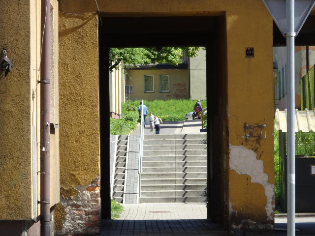 Two boys playing with a football.