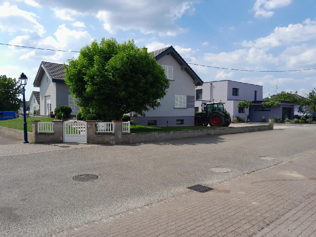 A house with a tractor.
