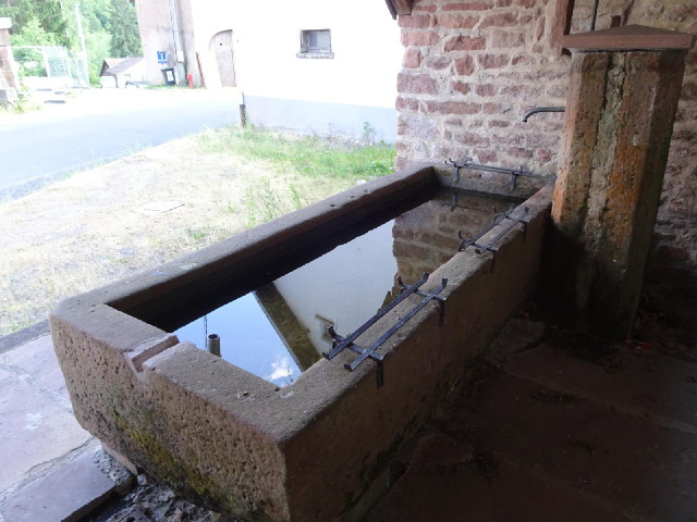 To take the picture of the sign, I'm standing next to this horse trough in an old shelter.