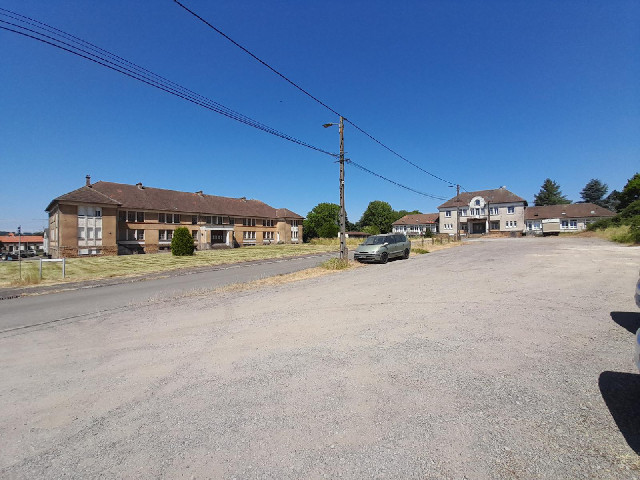 The circus is in Saint-Jean-l&egrave;s-Longuyon, where this square is surrounded on three sides by i...