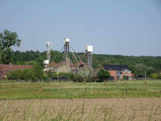 Some Belgian farm equipment, and a mobile phone tower.