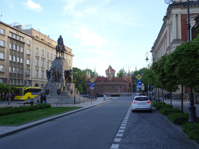 The monument to the Battle of Grunwald in the foreground, and Krak&oacute;w's Barbican at the end of...