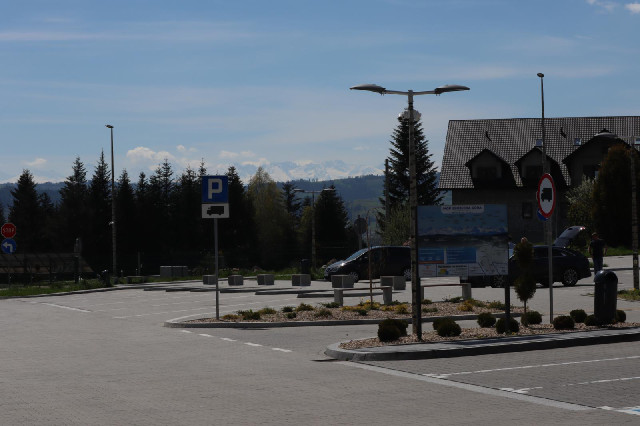 The sign explains which mountains they are. Most of them are in Poland and are about 2200 metres hig...