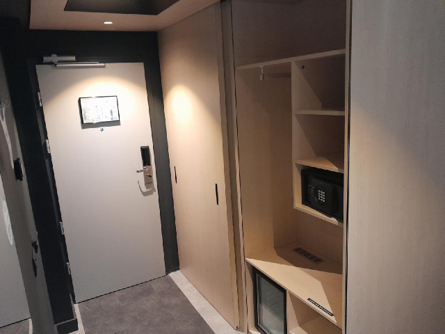 The sliding door reveals the bathroom if you slide it one way, and the wardrobe if you slide it the ...