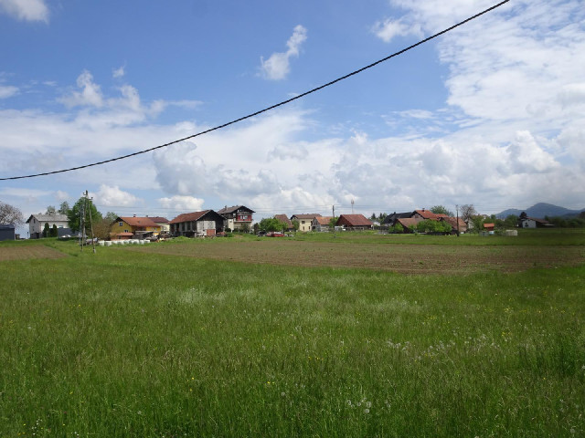 Some houses and distant mountains.