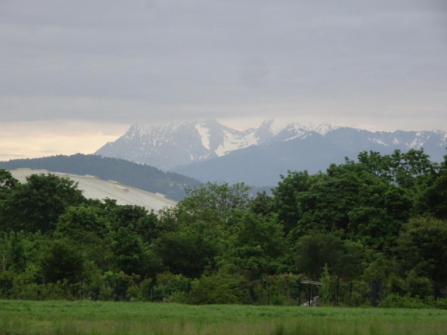 Snowy mountains visible from some parts of the city.