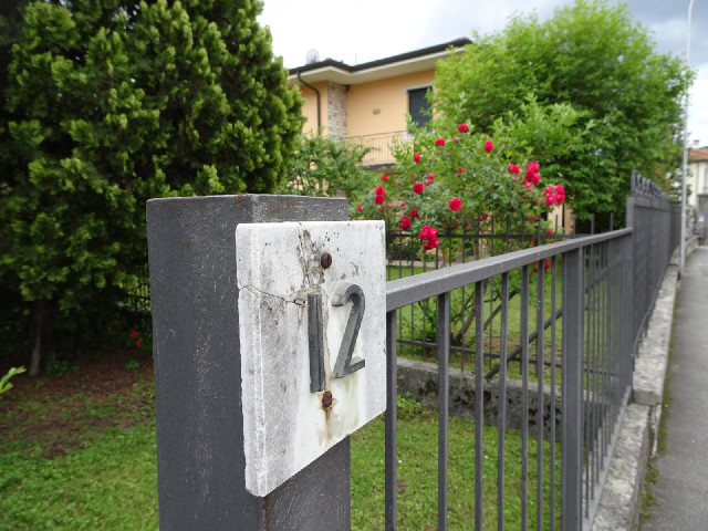 Every house here has its number on a little marble sign like the street name signs.