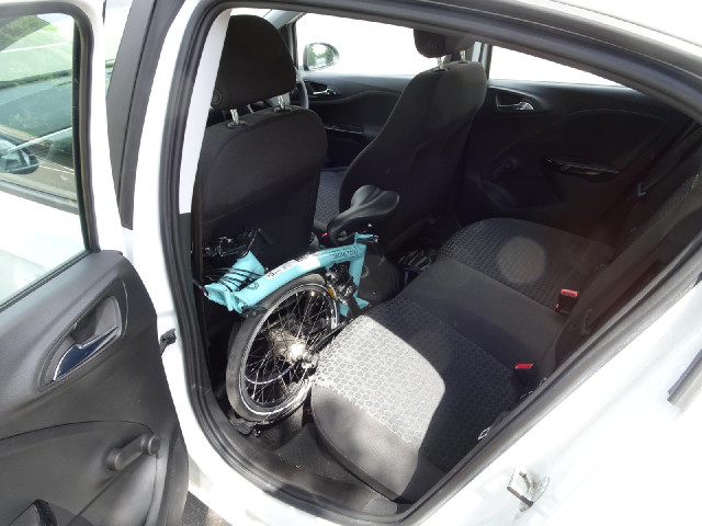 I'm using the bike three times today so I'm keeping it here behind the passenger seat instead of und...