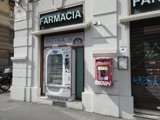 A condom vending machine in the street.