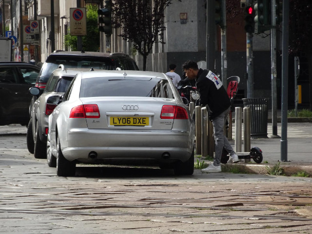 A British driver having a long discussion with a scooterer.