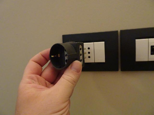 All the electrical sockets in this room are the Italian type but there is an adaptor to convert that...