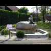 The sign says that this fountain is meant to represent water springing forth from a woman's hands bu...