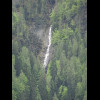 A waterfall high up a mountainside.