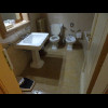 The bathroom looks quite old-fashioned. When I took this picture, it looked like the shower was in t...