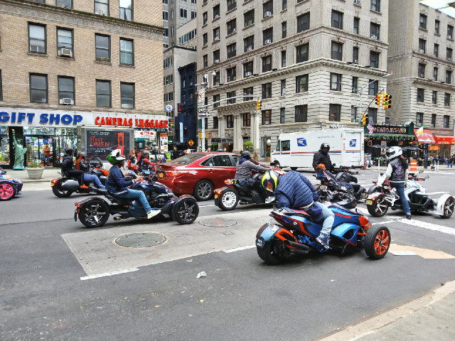 A bunch of noisy motor tricycles.