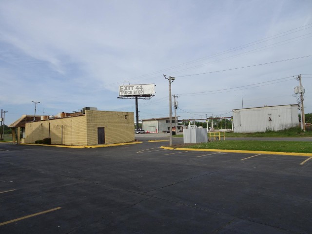 The surrounding premises look quite run-down. I don't know whether any of these businesses are actua...