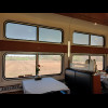 Dining car with rural scenery.
