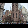 The Fifth Avenue Presbyterian Church. The two glass towers in the background to the left of it are t...