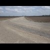 About 3 km of the road turned out to be stony, which I didn't expect. In the far distance in this pi...