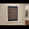 A large-scale illustration of woven threads made from real little woven threads.