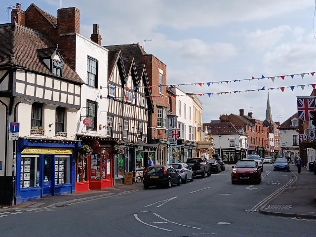 Today, I will be staying at the White Lion Hotel, on the left side of the street in this picture. I ...