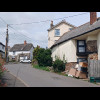 I like how the people in the house on the right have piled up so much junk in front of their front d...