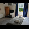 The bedroom is normal enough, except that the floor is so uneven that the wardrobe is leaning at a s...