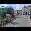 The view from my window. The plaque on the water fountain says that the road was widened in 1897 to ...